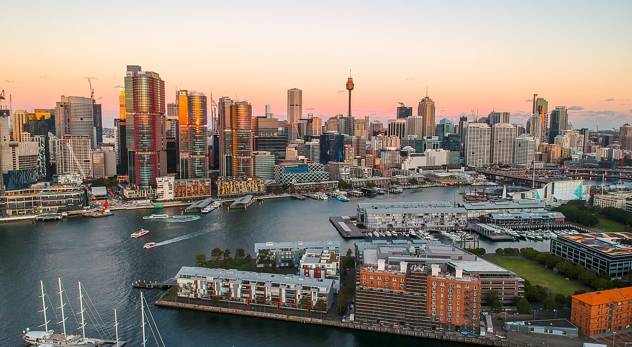 Sydney's Barangaroo and Darling Harbour waterfront, with CBD behind, aerial view from above Pyrmont at sunset