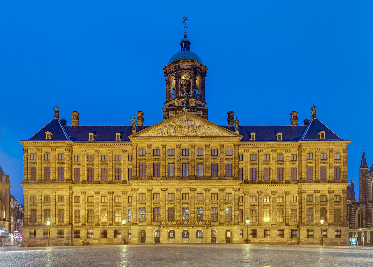 Blue hour view of front of the Royal Palace, Amsterdam, Netherlands. The palace was built as a city hall during the Dutch Golden Age and opened in 1655. The bui