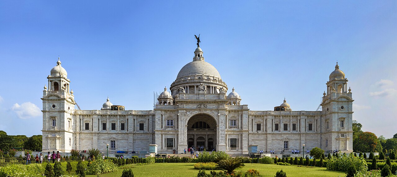 The Victoria Memorial is a large marble building in Kolkata (formerly Calcutta), West Bengal, India, which was built between 1906 and 1921. It is dedicated to t