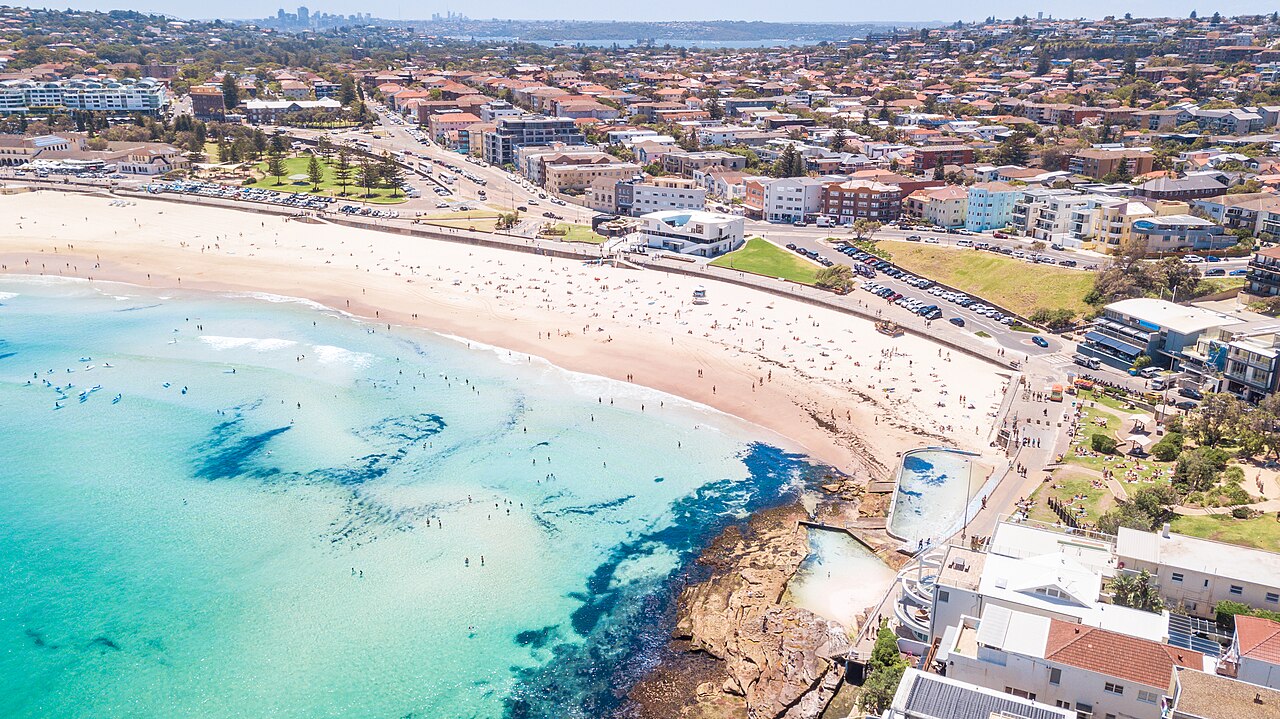 Bondi Beach, located in the Eastern Suburbs of Sydney, is Australia's most iconic beach, known for its parked sand, the rocks, the blue water and the warm tempe