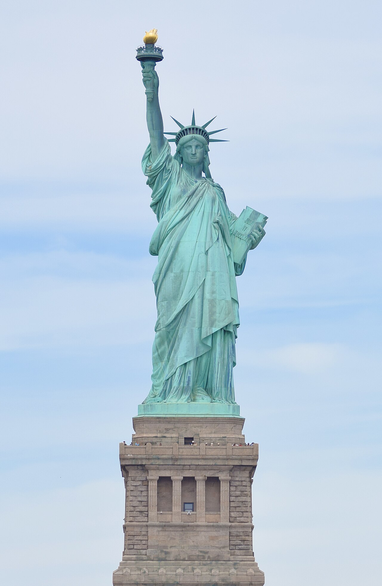 The Statue of Liberty as seen from the front in 2024, with pedestal and base visible.