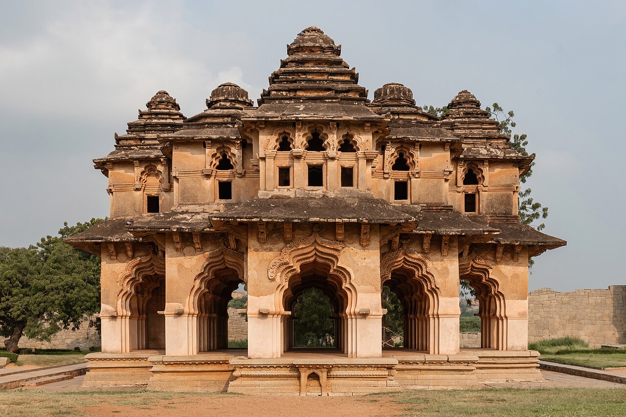 The image presents a flat elevation close-up of the Lotus Mahal in Hampi, showcasing its intricate architectural details. This view highlights the Mahal's disti