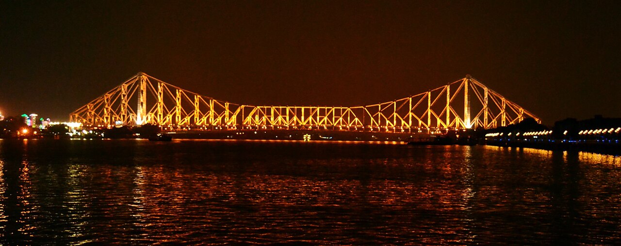 A panoramic shot of the well lit Howrah bridge, Kolkata, India